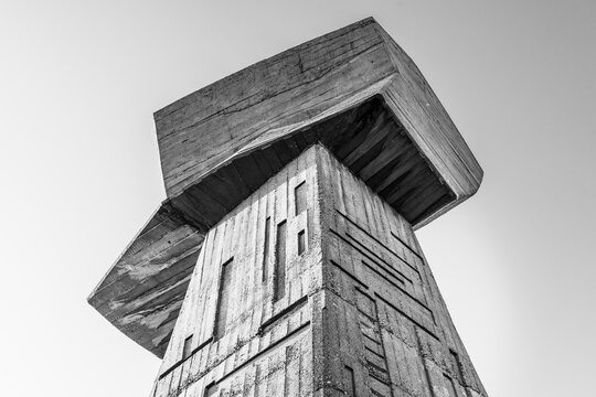 August 2020 - Bubanj Nis, Serbia: Socialist Brutalism Modernism abandoned communist huge concrete monument in shape of fists - symbol of resistance of partisans against fascism black and white photo