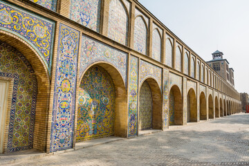 Fototapeta na wymiar Vintage colorful mosaic ceramic tile wall on the Edifice of the Sun (Shams ol Emareh) of the royal Golestan Palace in Tehran, Iran, which is a UNESCO World Heritage site