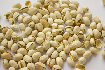 Pile of Pistachios isolated on white background. Pistachios closeup for your design and print. Nuts collection