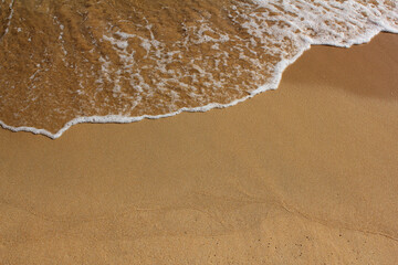 Fototapeta na wymiar close up Sand beach and spume.