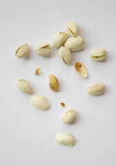 Pistachios isolated on white background, top view. 