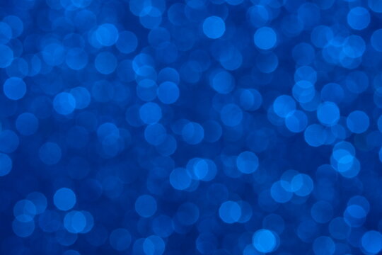 Blue light bokeh glitter background. Image photo