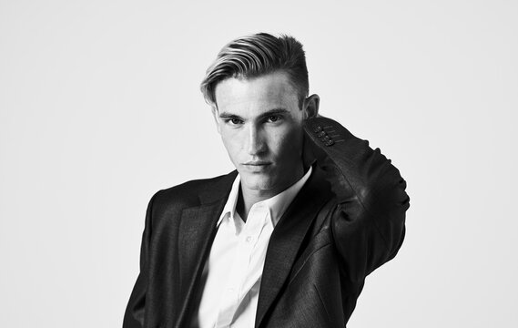 Handsome guy in a classic suit hairstyle black and white photography