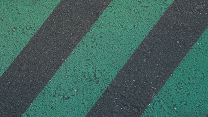 road texture with diagonal green lines