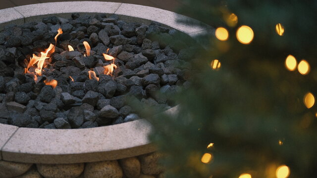 warm fire pit by the christmas tree