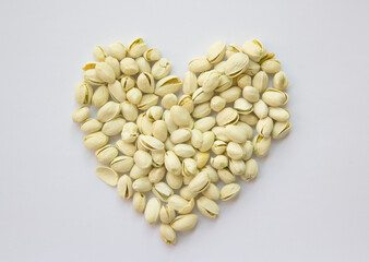 heart shape Pistachios isolated on white background, top view. 