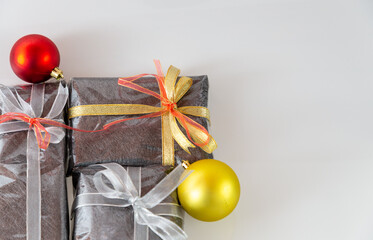 Wrapped Christmas Gifts and cake with Christmas decorations in Silver, Gold and Red
