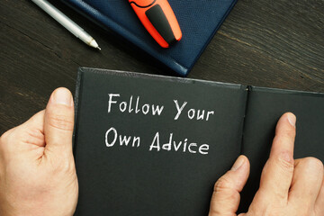 Motivational concept meaning Follow Your Own Advice with inscription on the sheet.