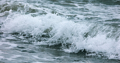 Wave in the sea with splashing water.