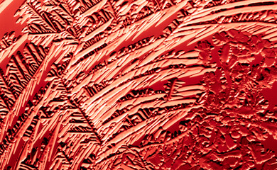 Red patterns from frost on glass as a background.