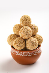 Indian sweet for traditional festival makar sankranti , Rajgira laddu made from Amaranth seed in Bowl on white background