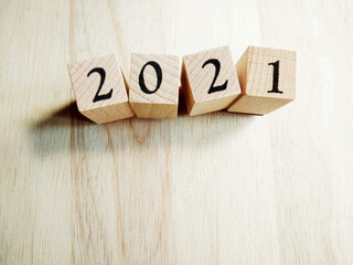 2021 Text New Year Card Template On Wooden Cubes On Wooden Background