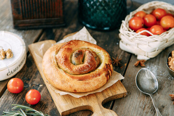 Traditional Moldovan and Romanian cake in the shape of a snail. Swirling round pie close-up.