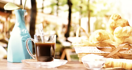 Fresh pastries on the table. French flavored croissant and coffee.