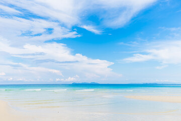 Fototapeta na wymiar Sea beach blue sky with cloud freedom beach empty beach morning sunshine day