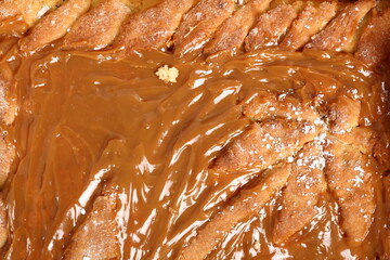 Shortcrust pastry cake covered with fudge caramel cream. Mazurek, Poland.