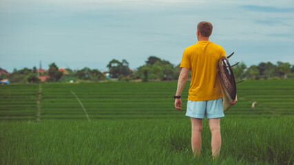 a man stands in a rice field. high quality photo