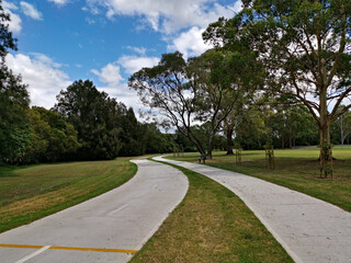 Fototapeta na wymiar Beautiful view of a park with double trail, cycling and walking trail running along side by side, Rydalmere, Sydney, New South Wales, Australia 