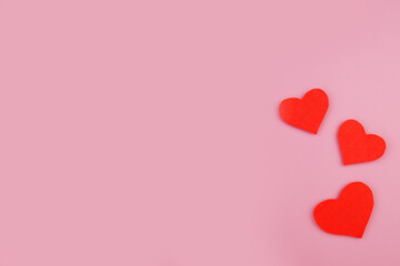 Pink background with paper cut hearts and copyspace. Valentine's Day, Mother's Day or Women's Day