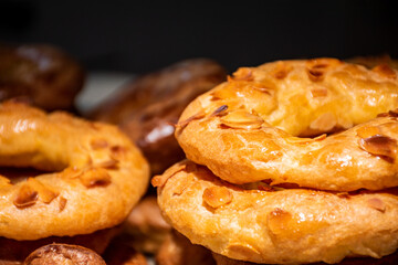 Almond doughnuts, homemade almond donuts. Homemade Spanish pastries with honey, butter and nuts.
