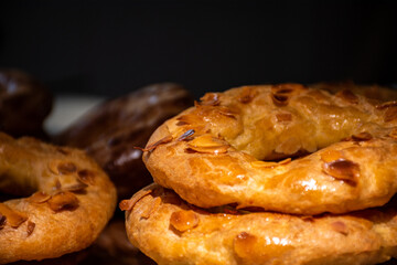 Almond doughnuts, homemade almond donuts. Homemade Spanish pastries with honey, butter and nuts.