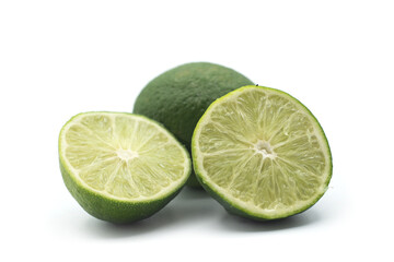 Closeup of fresh green lemon on white background