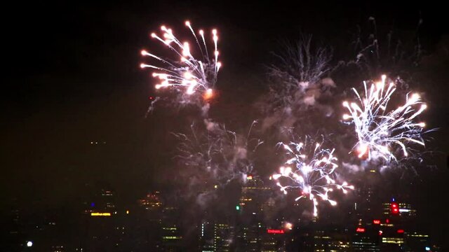 Dask sky over Sydney city CBD midnight new year fireworks celebration &ndash; 4k..
