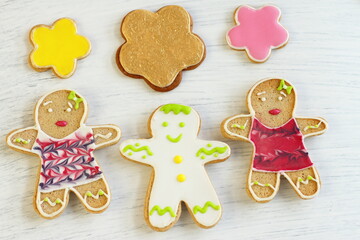 Gingerbread cookies for sweet present on birthday, anniversary, Saint Valentine's day, wedding. Dessert formed man, girl, star. Home made pastry on white wooden background
