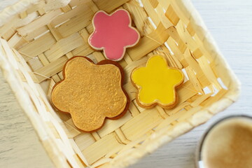 Gingerbread with coffee, ginger sweet homemade cookies in a basket with cup of hot drink, breakfast surprise for birthday Valentine's day