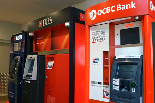 Various bank ATMs at Marina Bay Sands shopping Mall, Singapore. ATM is an electronic telecommunications device that enables customers to perform financial transactions. SINGAPORE - APR 22, 2018.