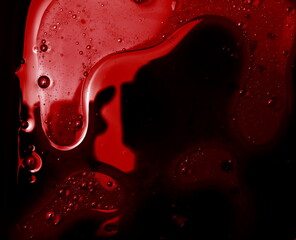 Red oil paint in water background and texture