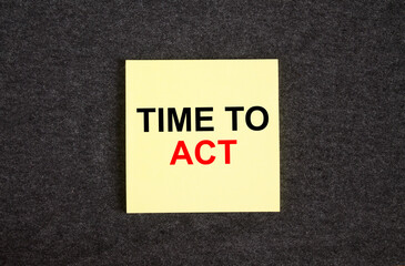 Yellow sticker on the dark gray texture background with text Time To Act