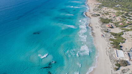 Fototapeta na wymiar incredible beach with a turquoise sea in Formentera island seen from above