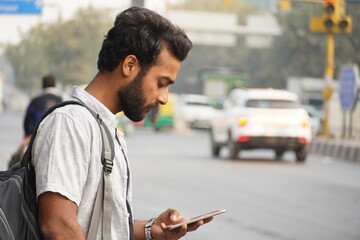 Busy Young Man In Smart Casua lwear And Talking On Mobile Phone Outdoor Image