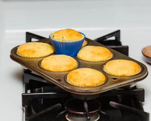 pan of corn muffins fresh from the oven sitting in the stove