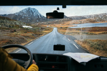 Focus on view from inside adventure car or camper van on amazing cinematic scandinavian landscape....