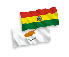 National vector fabric wave flags of Cyprus and Bolivia isolated on white background. 1 to 2 proportion.