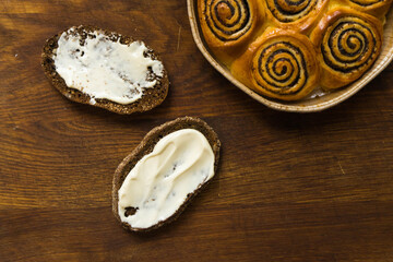 Top view of a wood table full of cakes and more breakfast classic sweet foods.