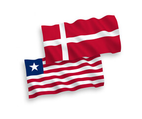 National vector fabric wave flags of Denmark and Liberia isolated on white background. 1 to 2 proportion.