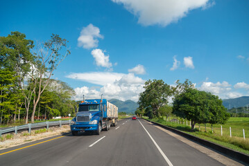 Fototapeta na wymiar Truck loading merchandise on a Colombian highway