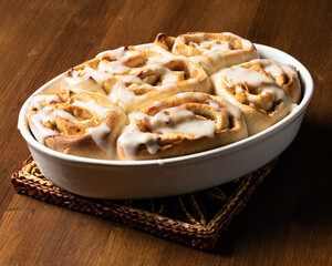 Veggie cinnamon rolls made with apple on a wooden board.
