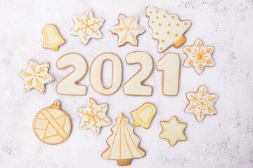 Homemade Christmas gingerbread cookies.Cookies of various shapes in sugar glaze. 2021 numeral made of gingerbread.