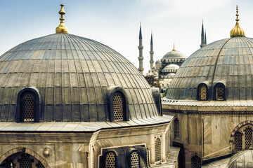 Blue Mosque or Sultan Ahmed Mosque viewed trough the window of Hagia Sophia, former Orthodox...
