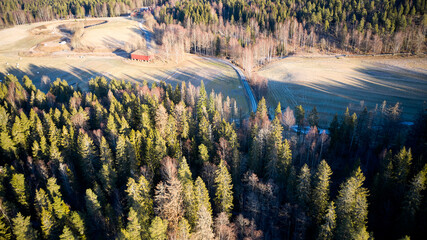 Drone photo shot from the sky. Countryside just outside of Oslo, Norway. Fields and wood mixed...