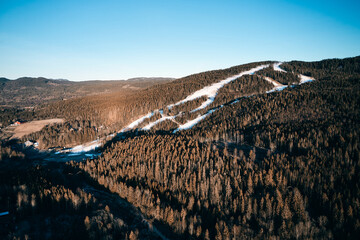 Drone photo shot from the sky. Countryside just outside of Oslo, Norway. Fields and wood mixed together. 