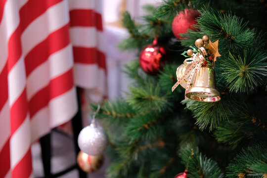 christmas spruce pine tree branch. festive bell ornament decoration.