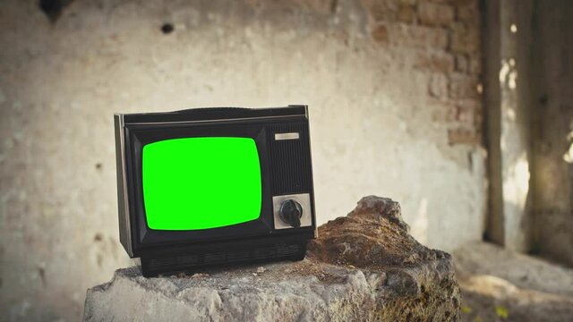 80S Television With Green Screen In A ruins. 4k UHD