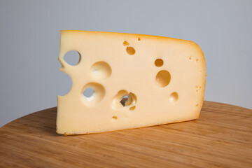 Swiss cheese emmenthal  on wooden board
