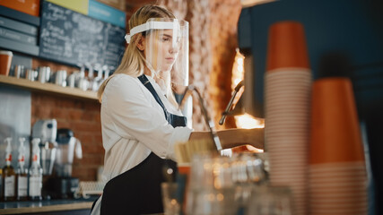 Beautiful Young Barista Wearing Face Shield is Making a Cup of Fresh Coffee in a Cafe. Bar Employee...