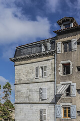 The architecture of traditional old buildings in Bayonne City Street. Bayonne, Department of Pyrenees-Atlantiques, Nouvelle-Aquitaine region, France.